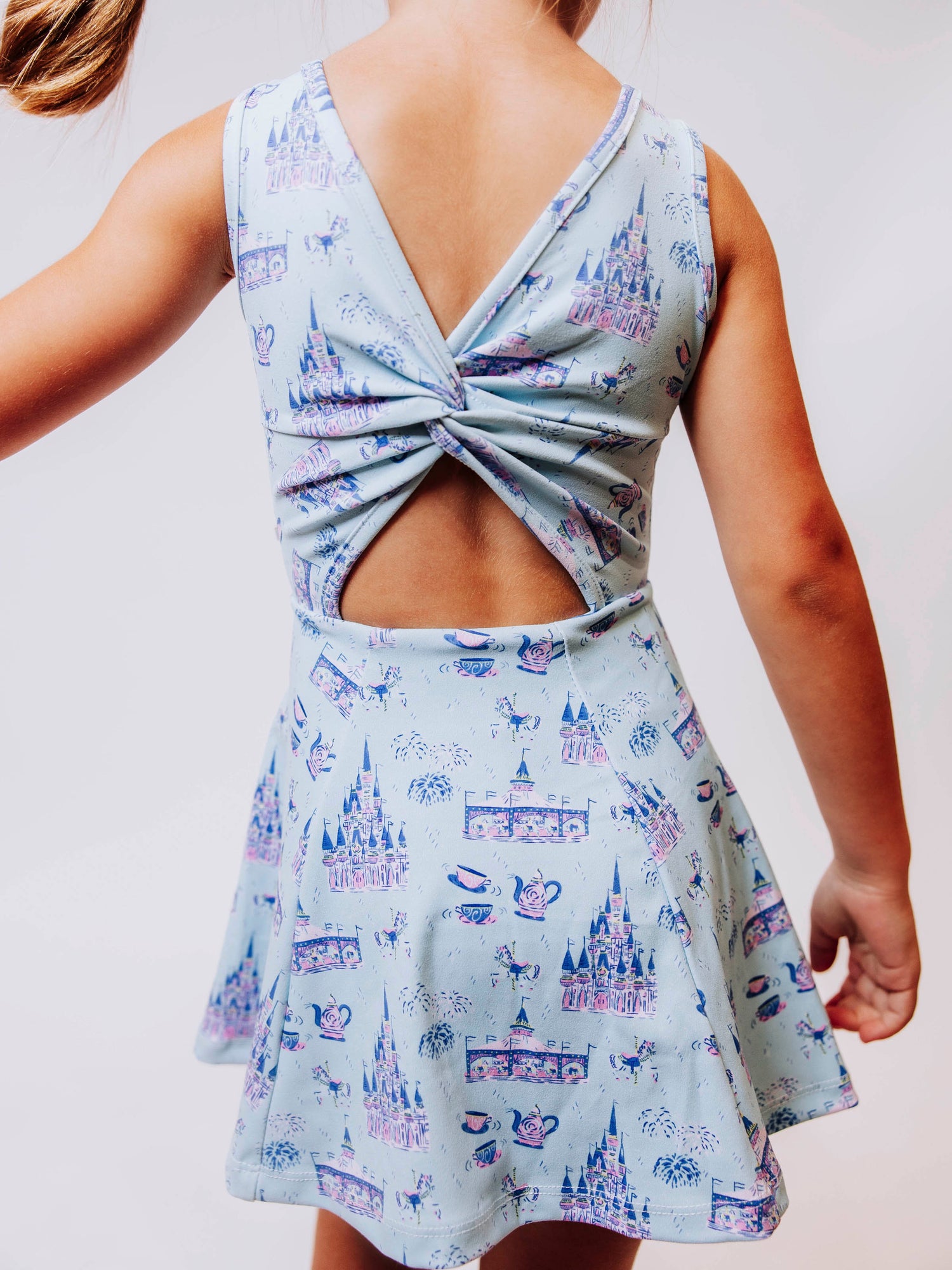 Serve up style and fun with our girls’ “Most Magical” tennis dress, designed for comfort, movement, and everyday play. This adorable sleeveless dress features a whimsical print inspired by magical castles, carousels, and fairy-tale adventures — perfect for little dreamers who love both sports and sparkle. The lightweight, stretchy performance fabric keeps her cool and comfortable from the court to the playground, while the flared skirt design allows for easy twirls and active fun.