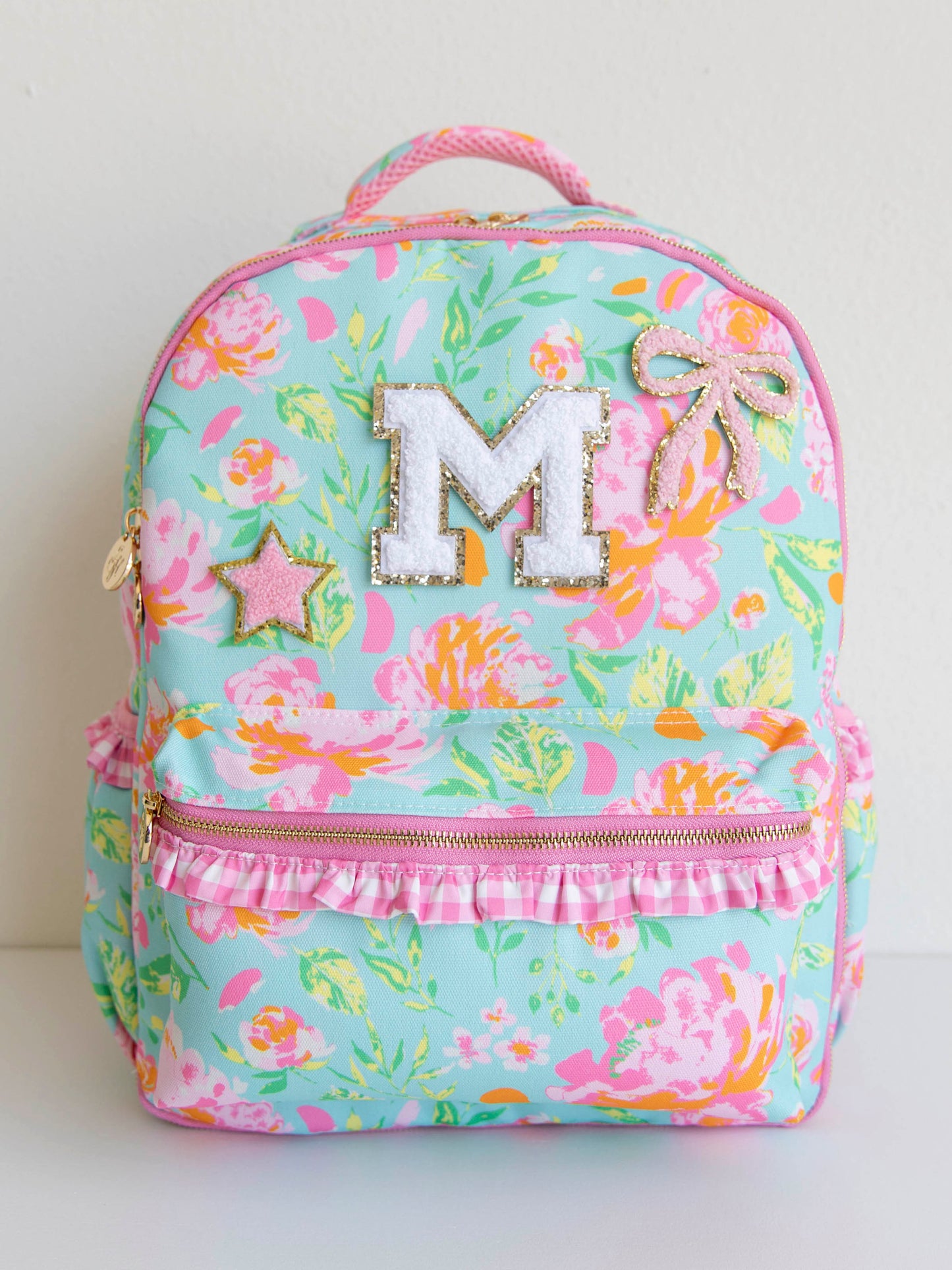 Colorful and floral backpack with patches on the front
