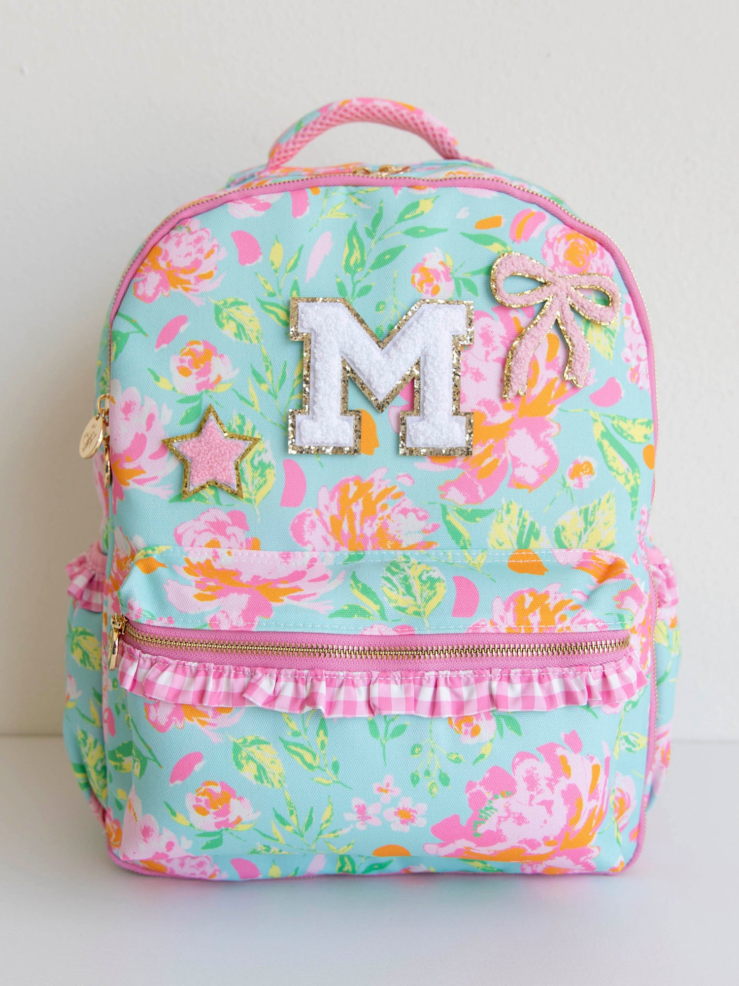 Colorful and floral backpack with patches on the front