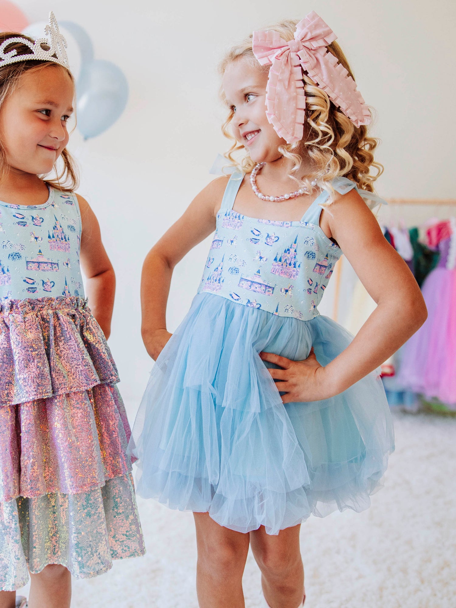 Bring a little fairytale sparkle to her wardrobe with our Most Magical Tulle Dress! Designed for twirls and make-believe moments, this enchanting girls’ dress features our whimsical Most Magical print on a soft, stretchy bodice paired with a full layered tulle skirt for the ultimate princess look. Perfect for birthdays, special occasions, or everyday play, it comfort and charm. Finished with delicate straps and a flowy silhouette, this dress makes every girl feel like she’s stepped into a fairytale!