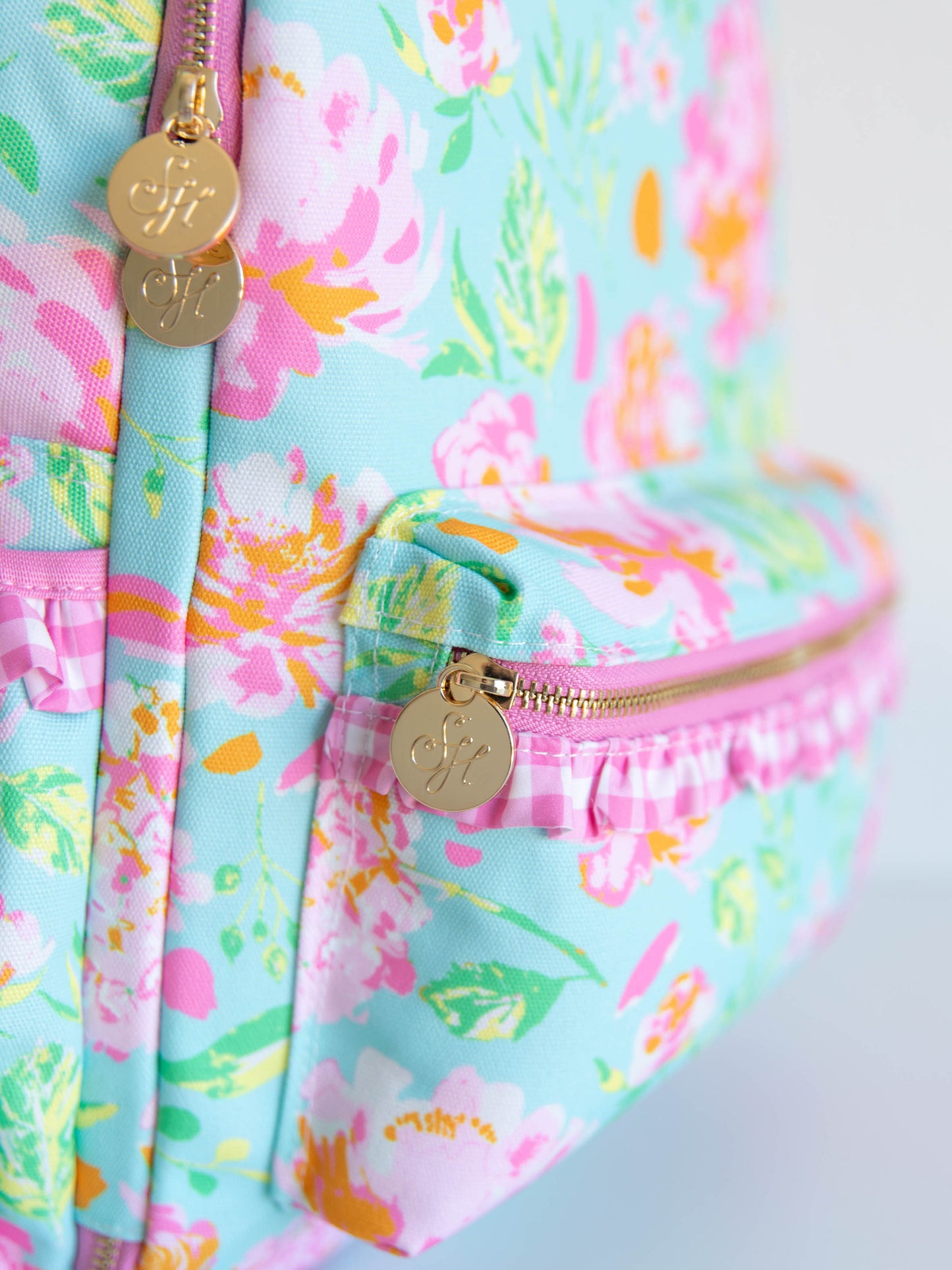 Colorful and floral backpack with gold SH zipper pulls