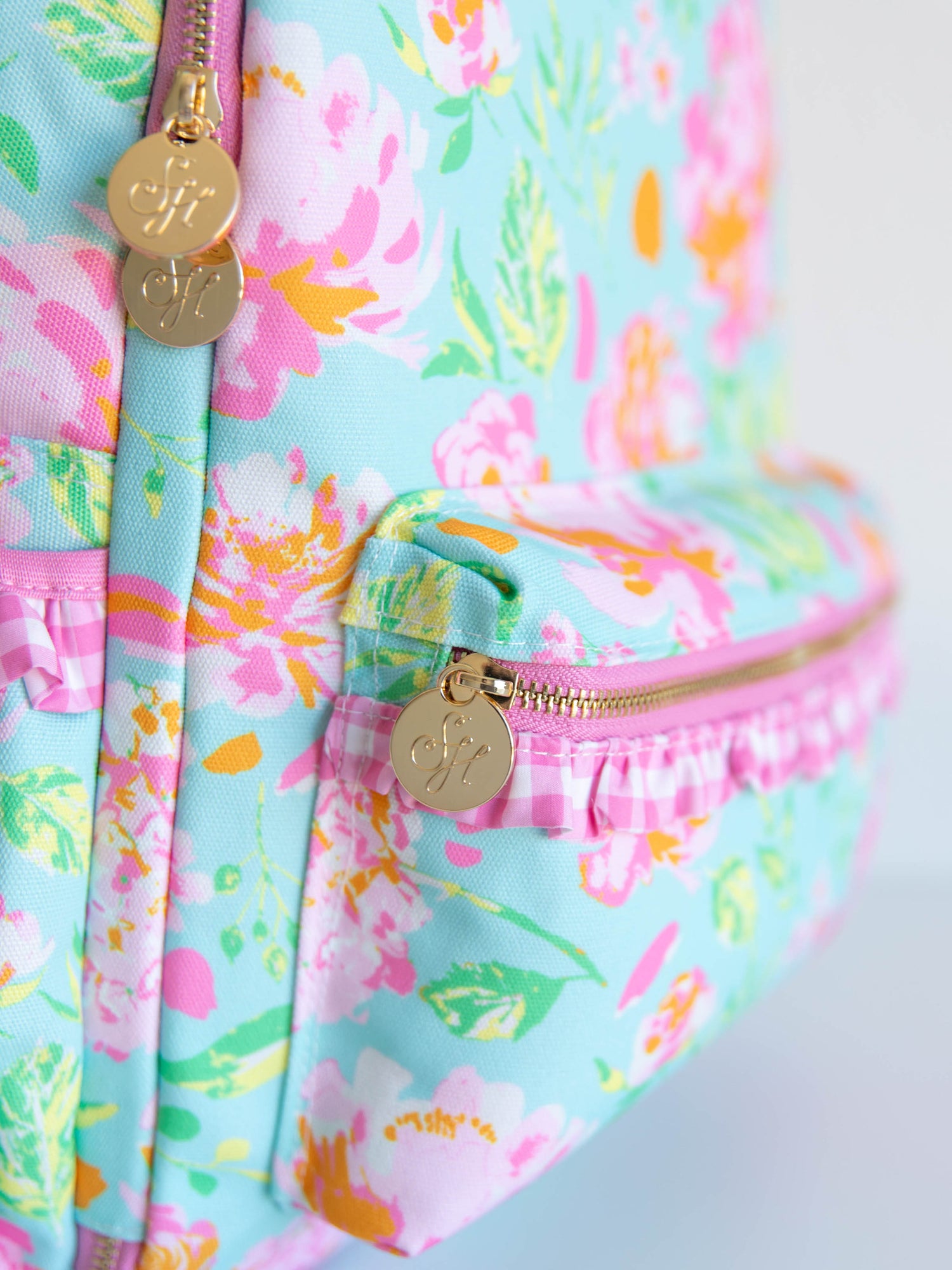 Colorful and floral backpack with gold SH zipper pulls