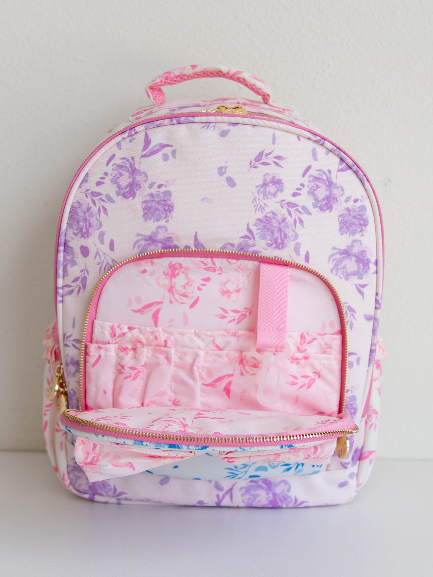 Inside front zipper of floral backpack. Pic shows different compartments. 