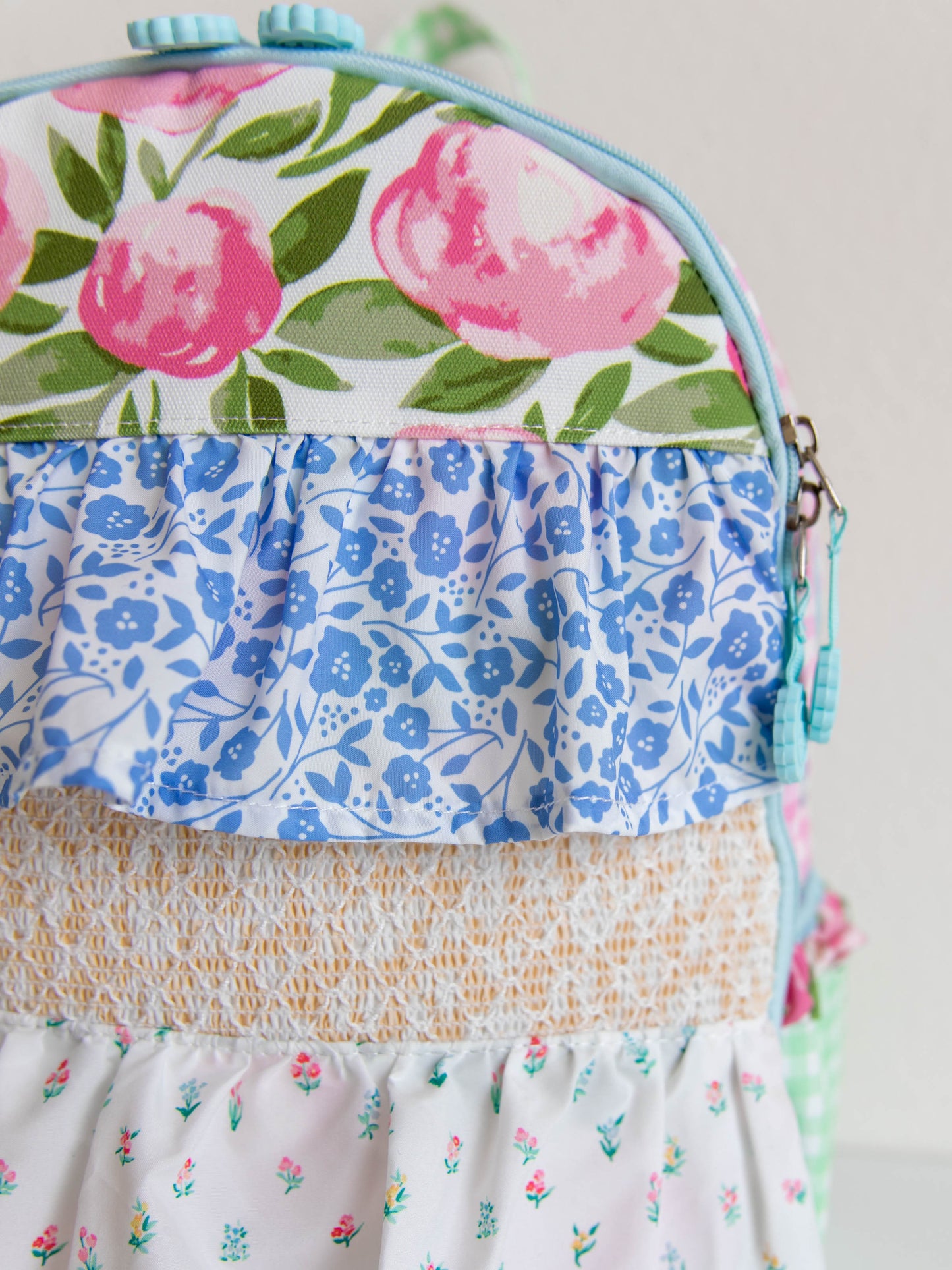 Backpack with floral and colorful designs