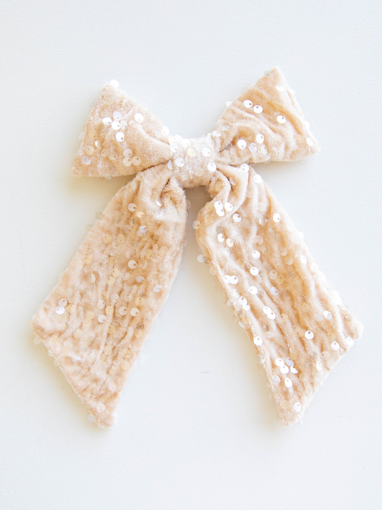 Add a touch of sparkle to every outfit with our girls’ sequin hair bow! This eye-catching accessory shines with shimmering sequins that glisten beautifully in the light. Designed with a secure alligator clip for easy styling, it’s perfect for holiday parties, special occasions, and everyday sparkle. Pair it with her favorite dress or festive outfit for the ultimate finishing touch!