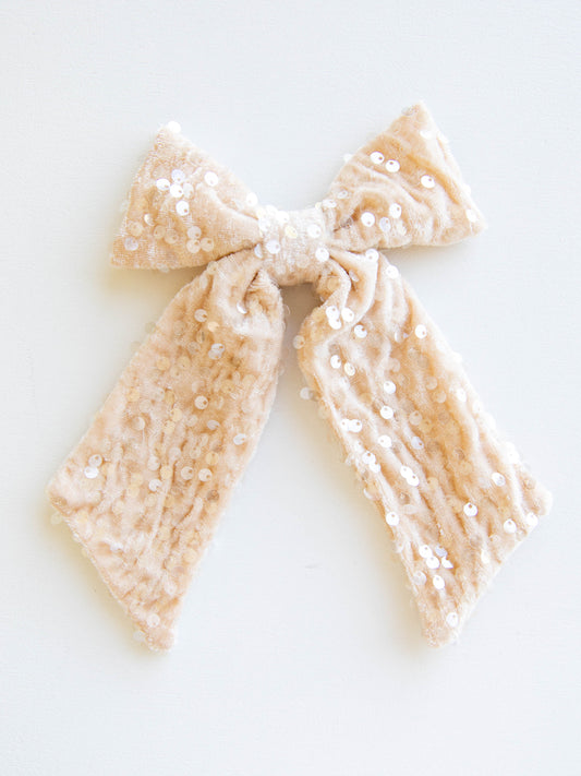 Add a touch of sparkle to every outfit with our girls’ sequin hair bow! This eye-catching accessory shines with shimmering sequins that glisten beautifully in the light. Designed with a secure alligator clip for easy styling, it’s perfect for holiday parties, special occasions, and everyday sparkle. Pair it with her favorite dress or festive outfit for the ultimate finishing touch!