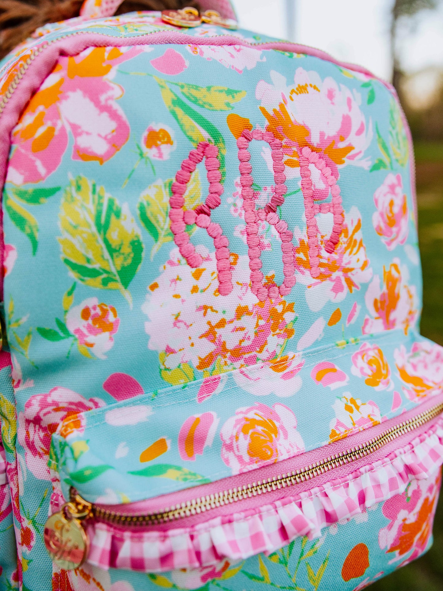 Floral and colorful backpack with embroidery customization in pink