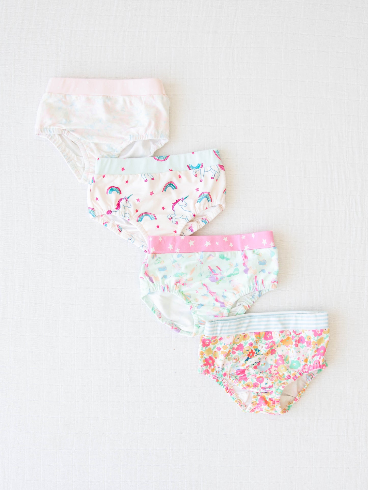 four pairs of girls panties in different patterns