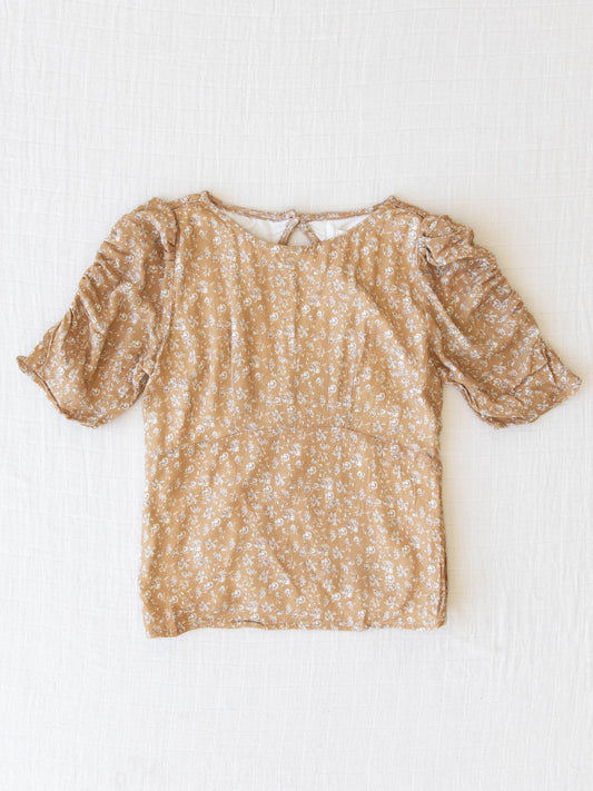 Smocked Cutout Top - Brown Petals. This top has a smocked back, elastic synched sleeves, and keyhole back.  In a pattern of dusty brown and cream flowers on a rich tan background.