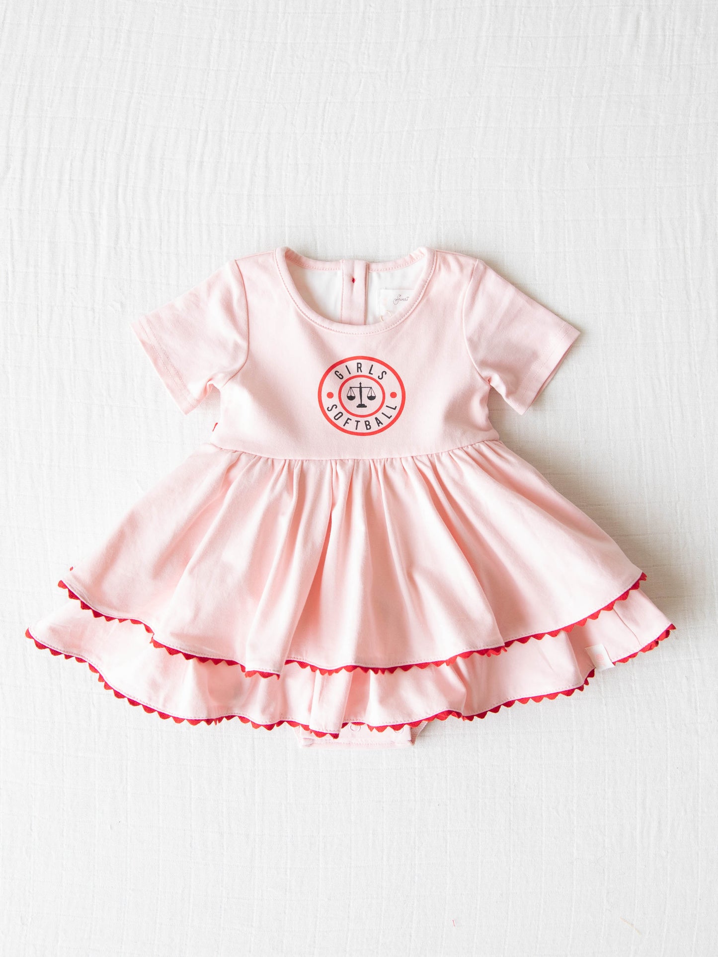 Belle Bubble - Girls Softball. This pink double skirted dress has the same Girls Softball logo on the front as our Girl’s Softball Dress & Hat.