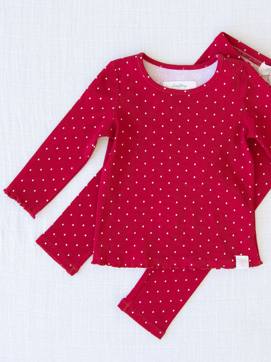 Frilled Sleeve Set - Christmas Dotty. The long sleeve set comes in a pattern of white polka dots on a red background.