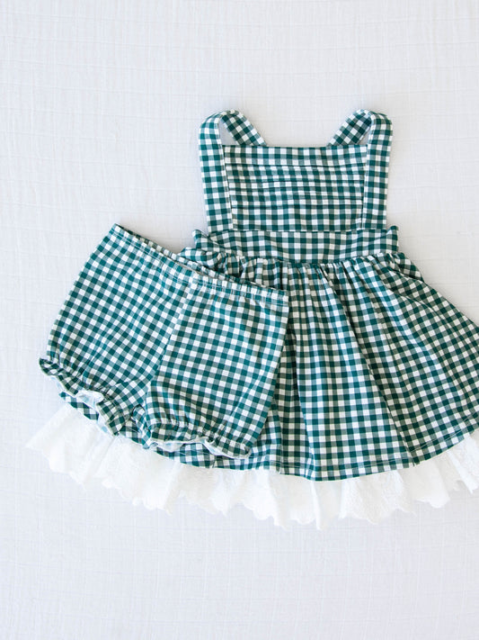 Pinafore - Mistletoe Check. This crisscross strapped pinafore comes in a blue/green and white check pattern.