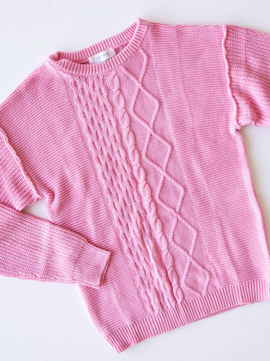 Women's Cable Knit Sweater – Bright Pink. This crew neck sweater featuring a unique cable knit design down the middle. 