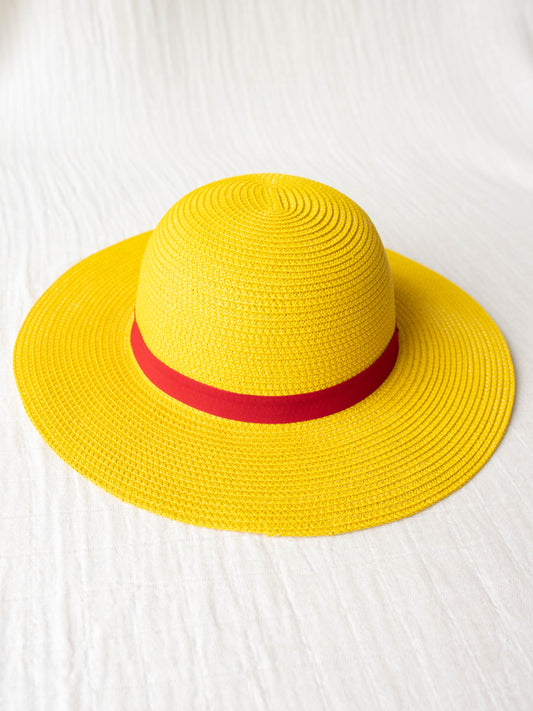 Straw Hat - Madeline. This bright yellow wide brimmed hat has a red stripe around it and is the perfect finishing touch for a Madeline costume when paired with our Madeline Swing Dress. 
