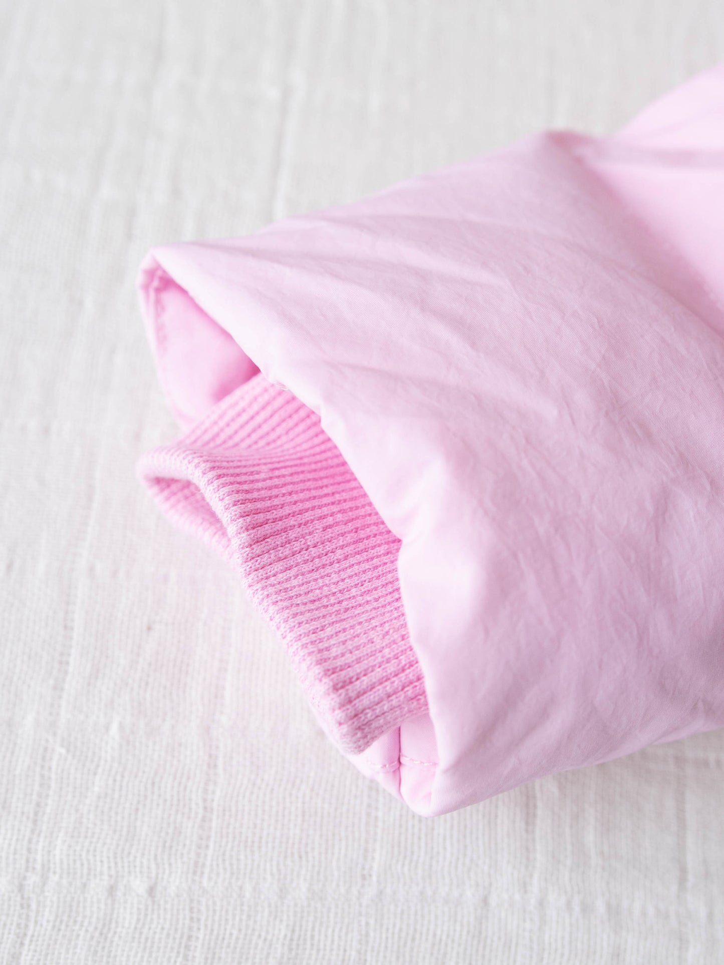 Keep her cozy and cute all season long in our Pink Puffer Jacket — the perfect blend of warmth and style! This soft, quilted jacket features a full zipper closure with a button placket, ensuring extra protection from chilly winds. Hidden front pockets keep little hands warm (or treasures tucked away), while the adjustable waist toggle allows for the perfect, comfortable fit. Designed in a beautiful blush pink hue, this girls’ puffer jacket pairs effortlessly with any winter outfit for a look that's fun!