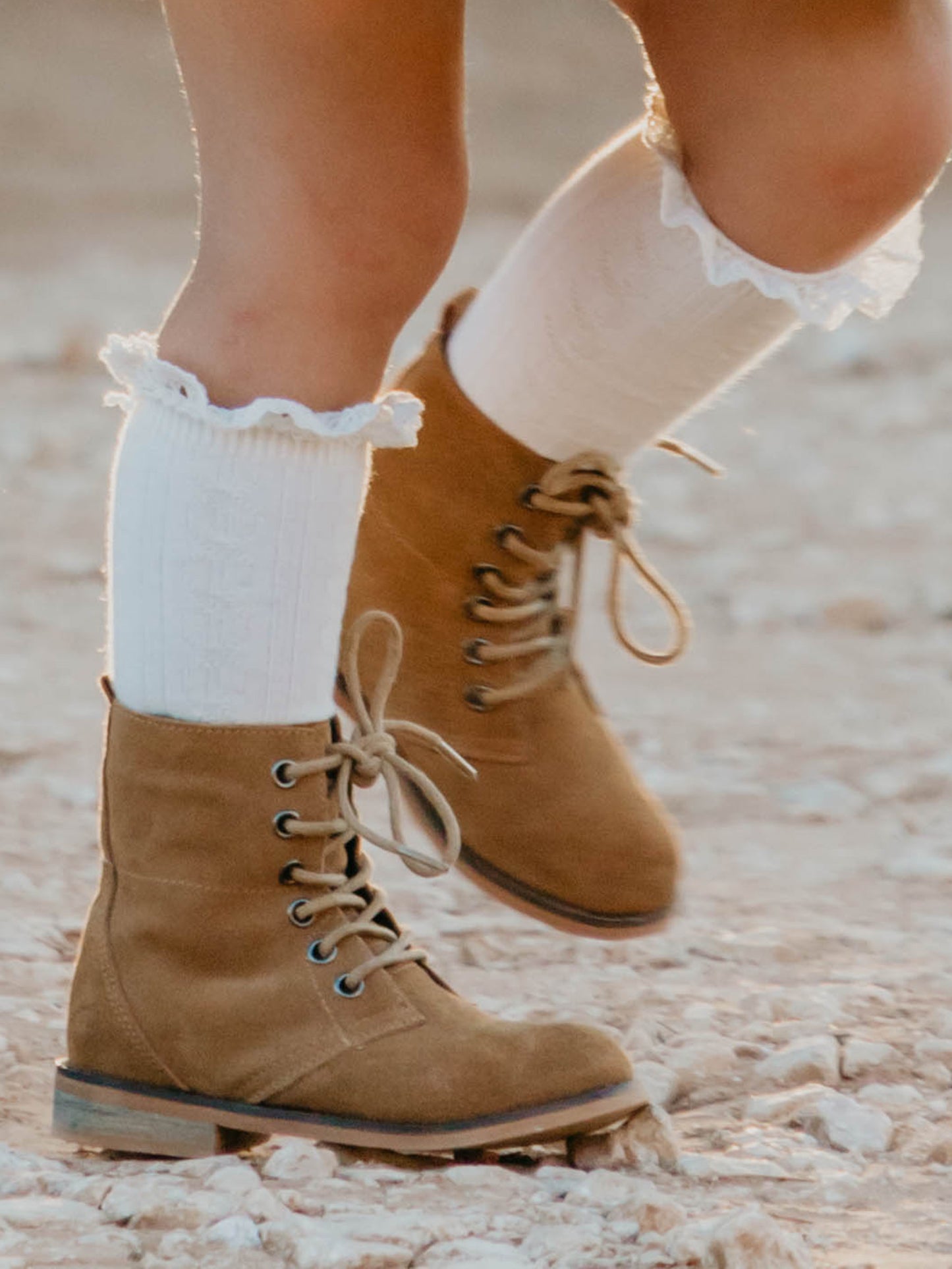 Sharp Boots. This camel suede lace-up boot has a rubber sole, metal eyelets, and nice thick laces. With a design that supports the ankle, these boots are perfect for some outdoor fun.