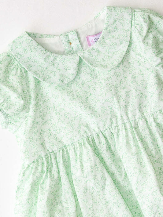 Classic Bubble – Minty Petals. This Classic Bubble has a peter pan collar and buttons down the back. It is a pattern of dark mint line drawn flowers on a background of light mint.