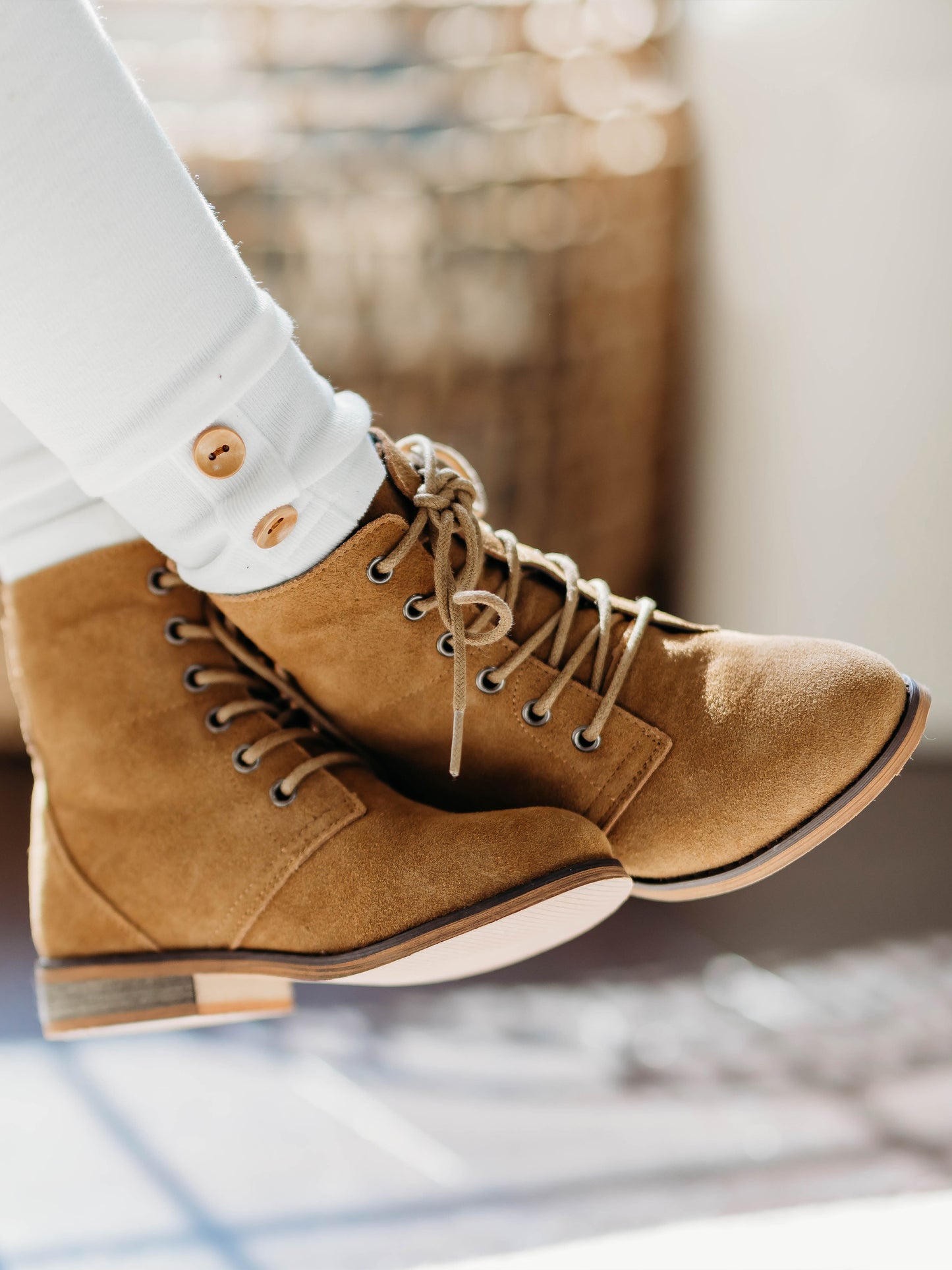 Sharp Boots. This camel suede lace-up boot has a rubber sole, metal eyelets, and nice thick laces. With a design that supports the ankle, these boots are perfect for some outdoor fun. 
